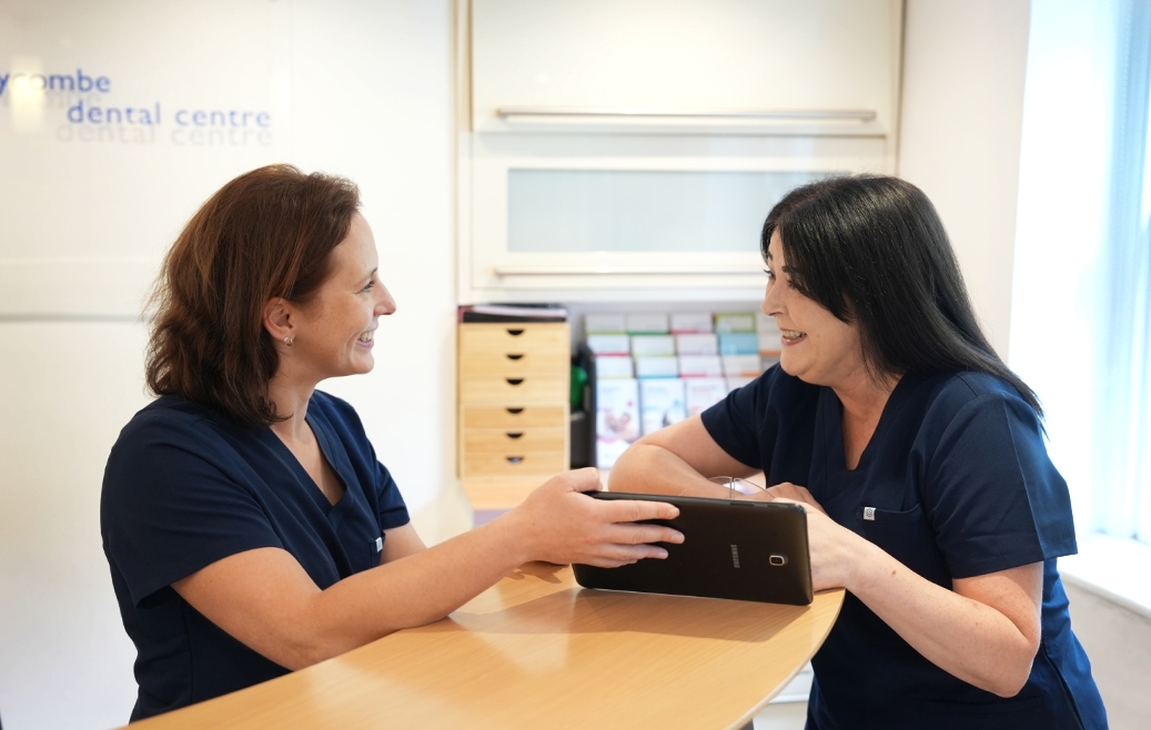 Dental team members discussing patient care at Wycombe Dental Centre.