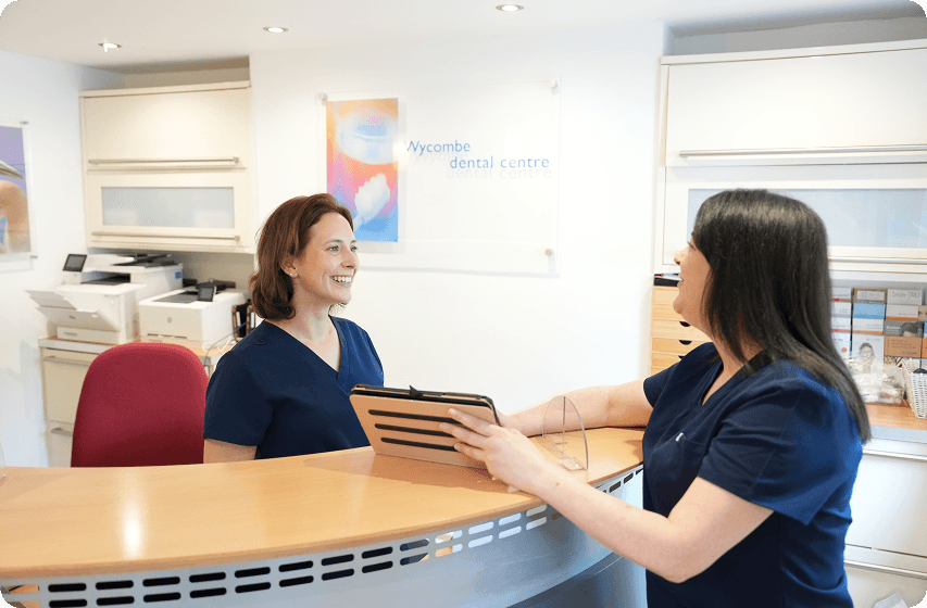 Dentist discussing the cost of professional teeth whitening treatment in High Wycombe