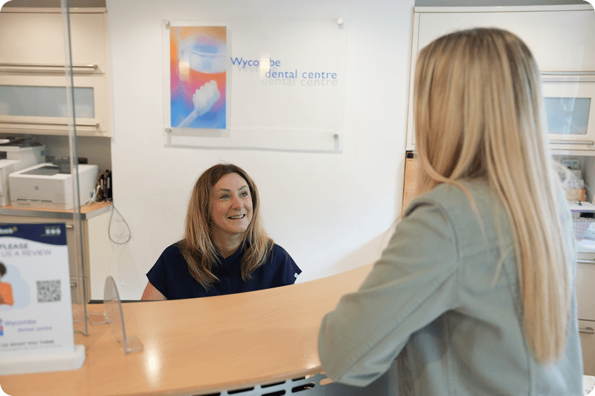 Dentist discussing the cost and treatment planning for composite bonding in High Wycombe