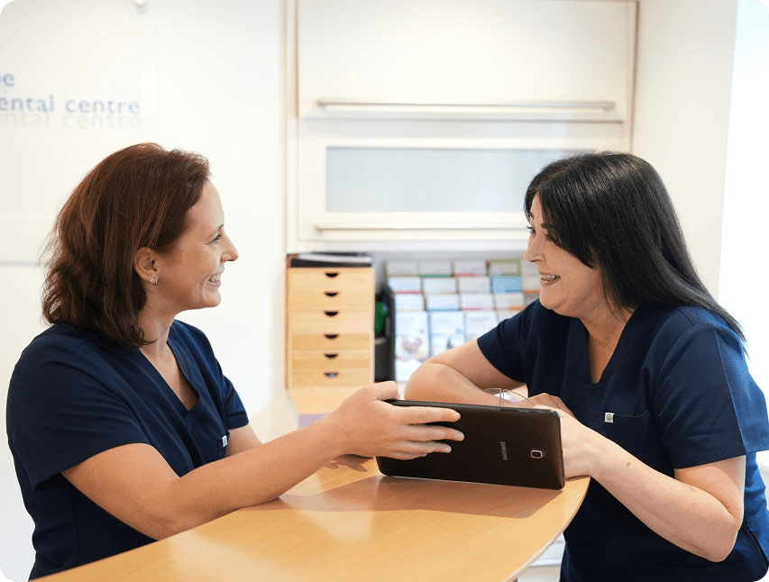 Dentist discussing the cost of root canal treatment in High Wycombe