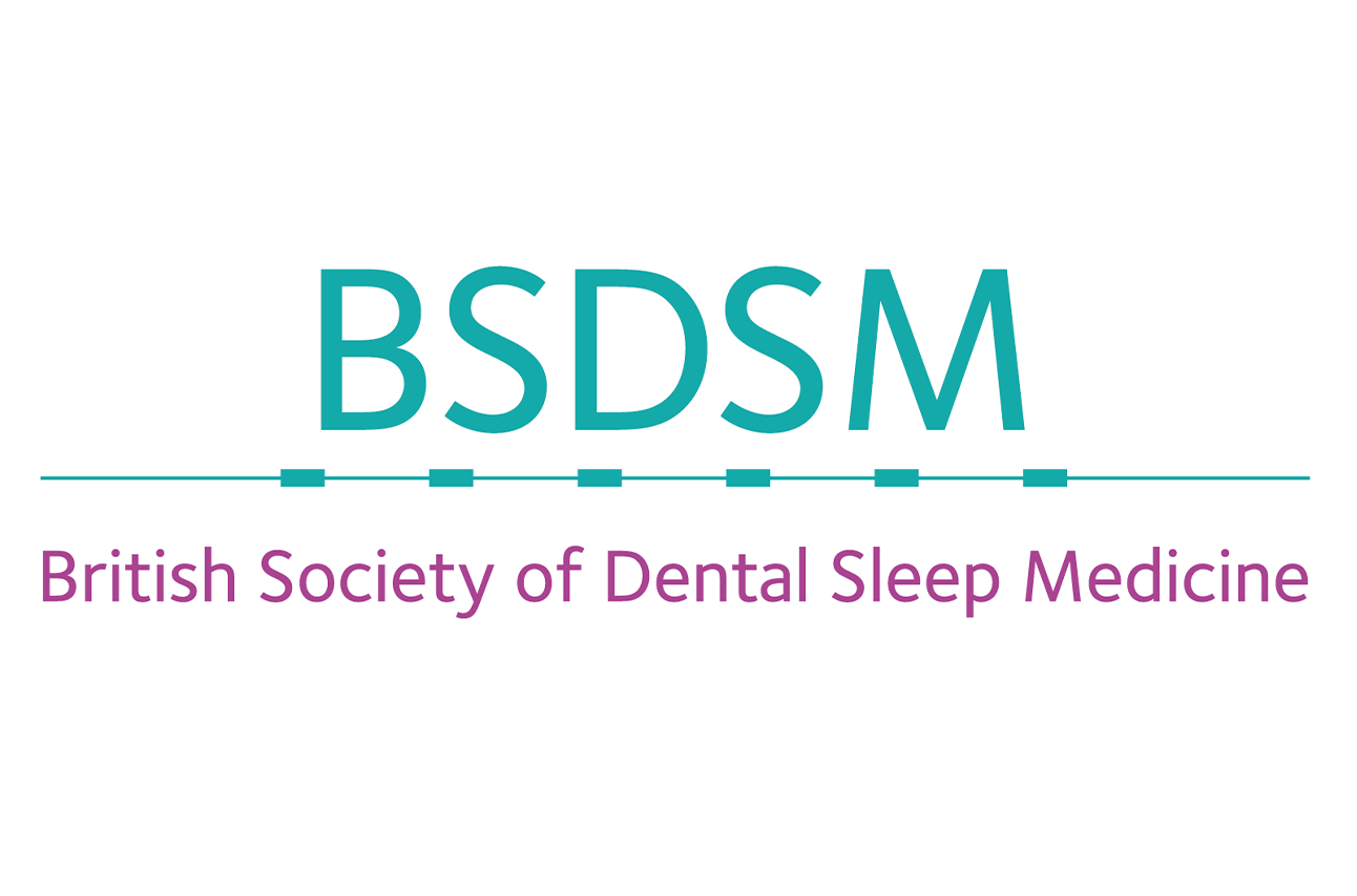 Patient with worn teeth discussing bruxism treatment with a dentist