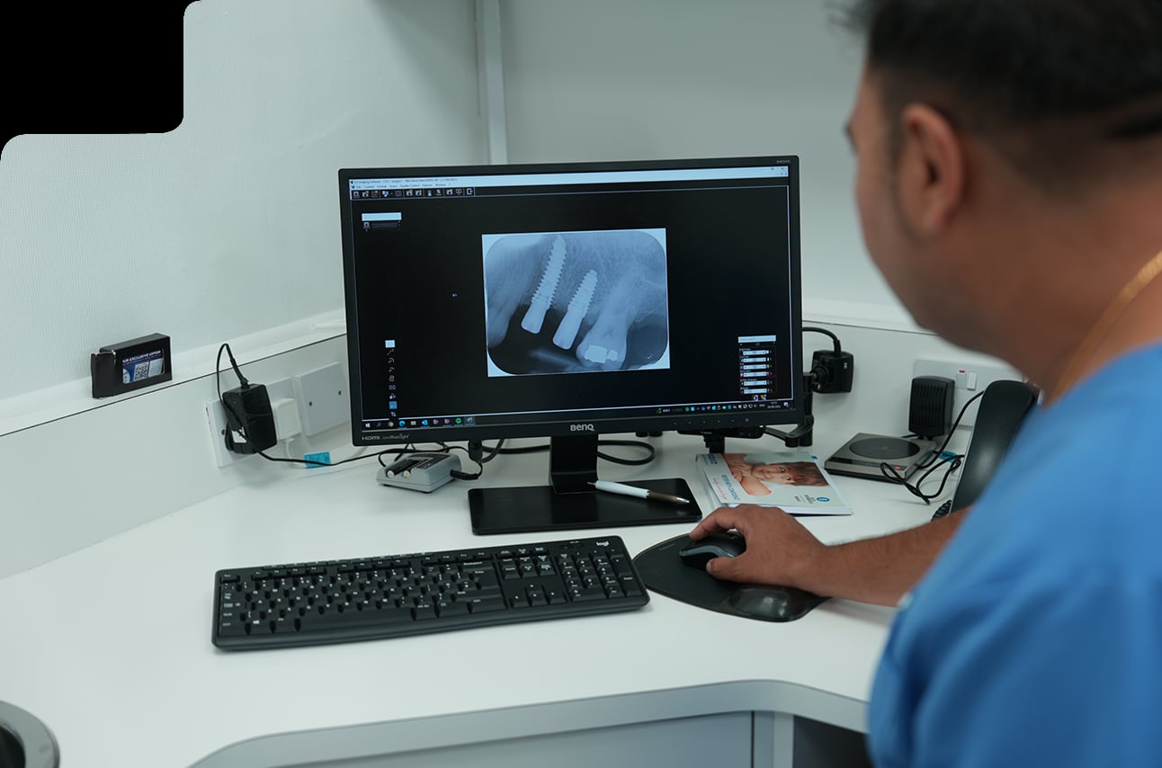 Dentist assessing whether dental implants are suitable for a patient