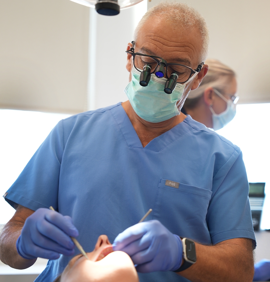 Dentist carrying out a dental examination for jaw pain and teeth grinding in High Wycombe