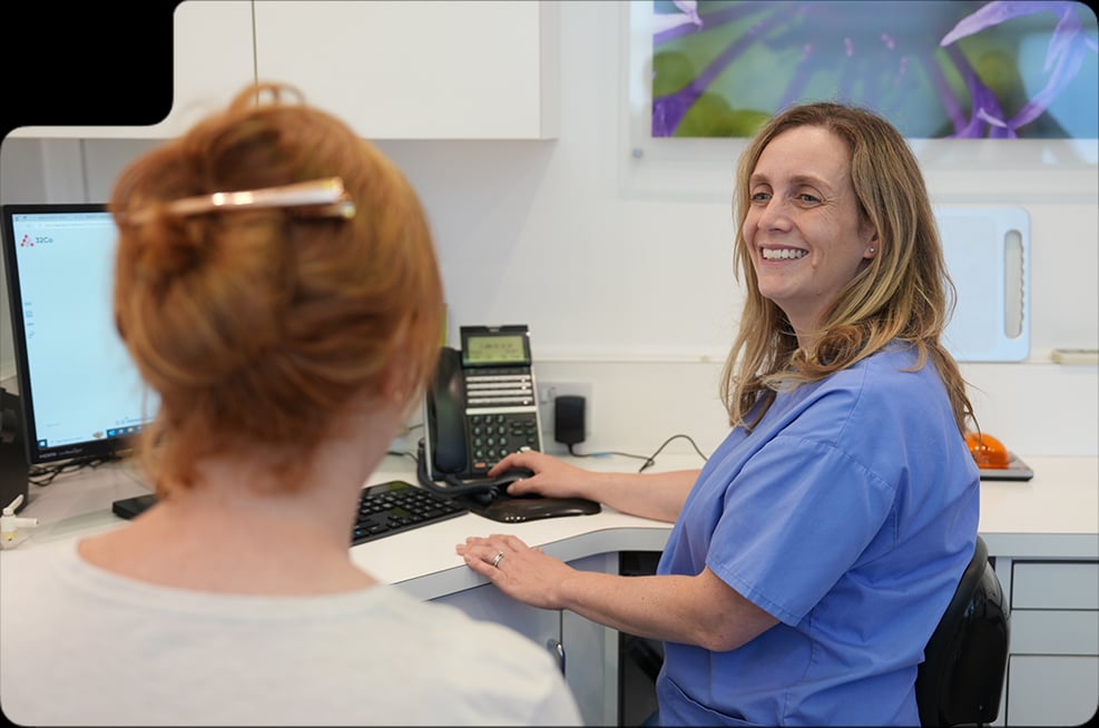 Clinician discussing the cost of facial aesthetic treatment during a consultation in High Wycombe
