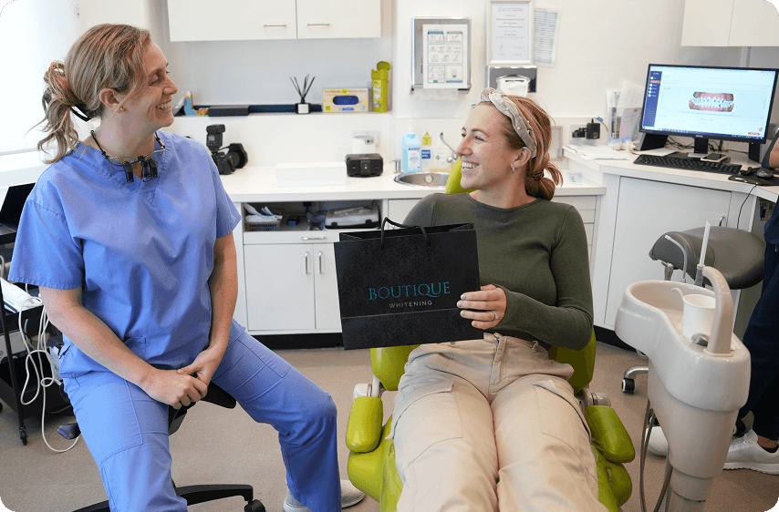 Dentist assessing whether professional teeth whitening is suitable for a patient
