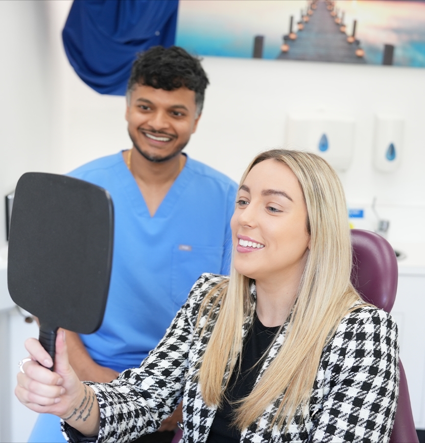 Porcelain veneer consultation with patient reviewing smile results at a High Wycombe dental practice