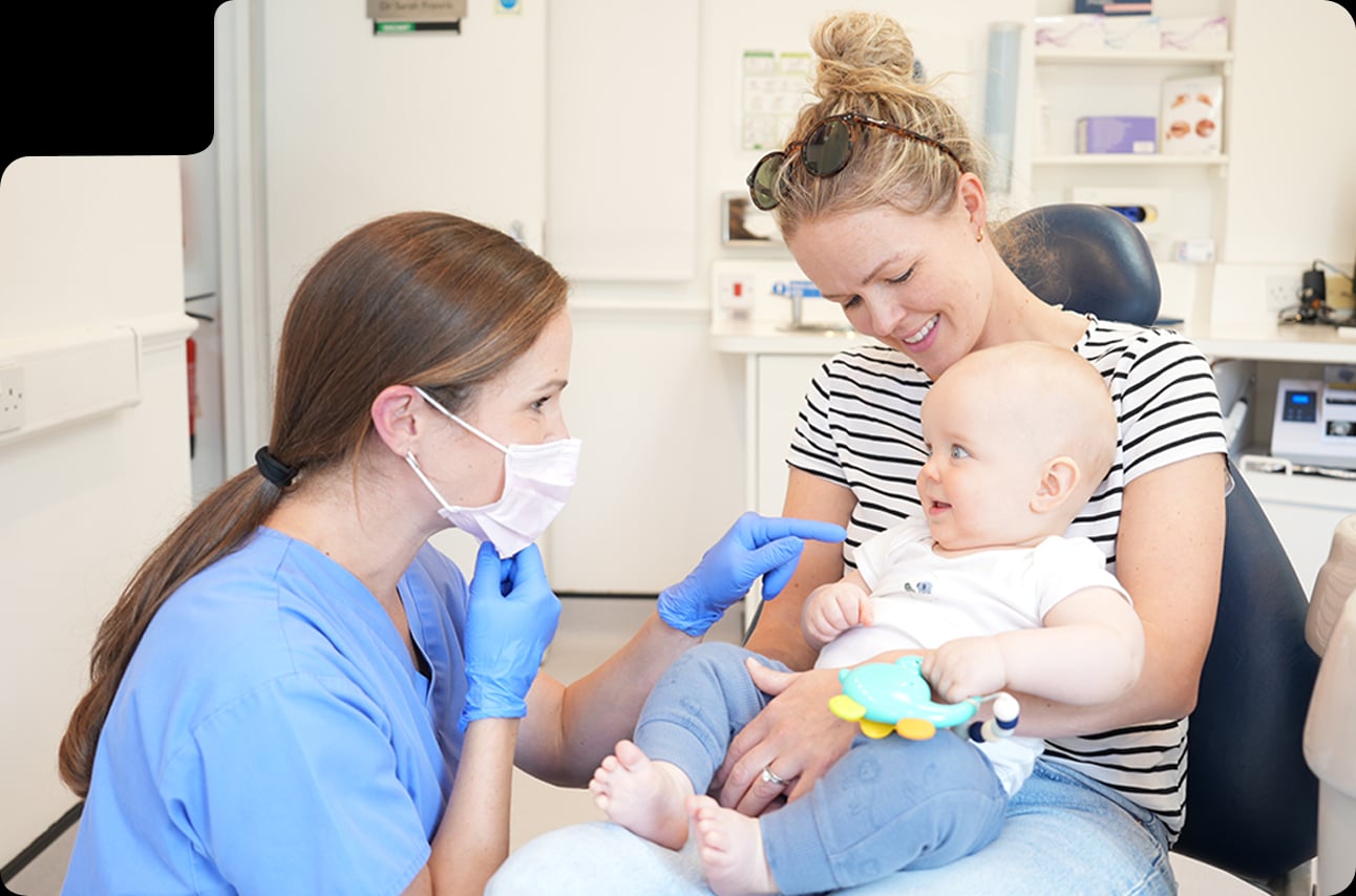 Dentist assessing a patient during a routine dental examination